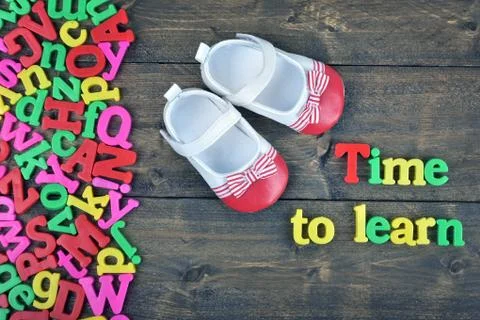 Time to learn on wooden table Stock Photos