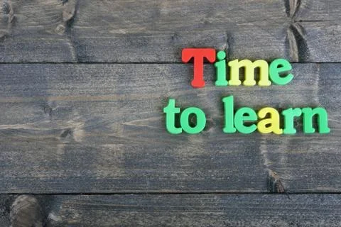 Time to learn on wooden table 스톡 사진