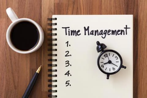 Time management concept with list on notebook, clock and coffee cup from top  Stock Photos