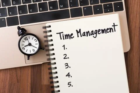 Time management concept with list on notebook and clock on computer from top  Stock Photos