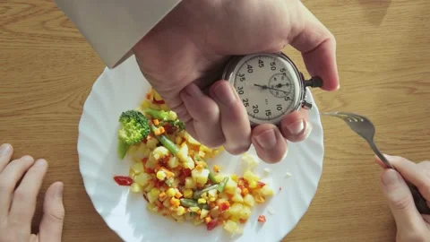 A time measuring, how fast a man eating his breakfast 库存影片 235154951