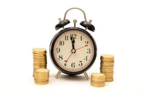 Time is Money concept with Coins stack around clock Foto stock