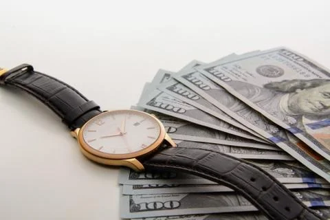 Time is money. Watch and dollars Stock Photos