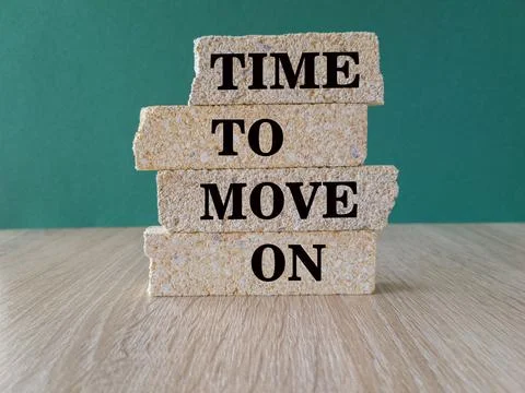 Time to move on - concept words on brick blocks on wooden table. Stock Photos