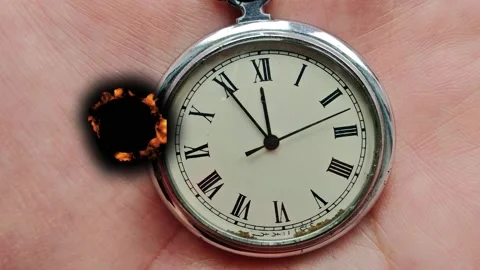 Time moves as a clock shows the passing seconds in a person's hand Stock Footage 342831720