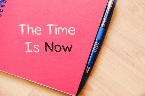 The time is now text concept on notebook Stock Photos