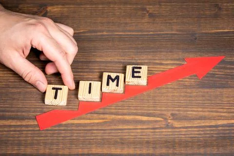 TIME planning concept. Red arrow indicates the development and growth Stock Photos