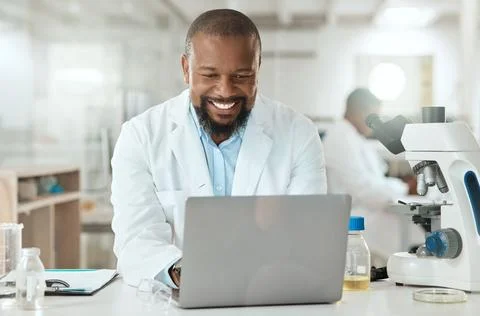 Time to prove some things wrong. a handsome mature scientist sitting alone in Stock Photos