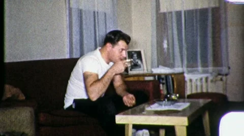 TIME TO RELAX Man Drinks Coffee Living Room 1960s Vintage Film Home Movie 8mm 스톡 동영상 10575819