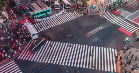 Time Remap Timelapse of crowd people pedestrians walking across zebra crosswalk Video stock 186739141