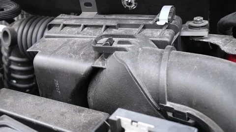 Time to replace dirty damaged air filter of a Nissan pulsar engine Stock Footage 139421679
