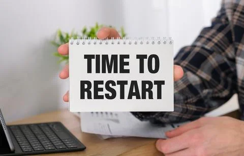 Time to Restart text on page in notepad desktop calculator, Notepad and glass Stock Photos