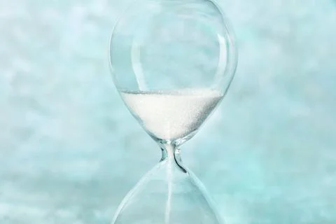 Time is running out concept. A close-up of an hourglass with sand falling Foto stock