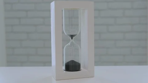 Time is Running Out - White Hour Glass with Black Sand Stock Footage 126912996