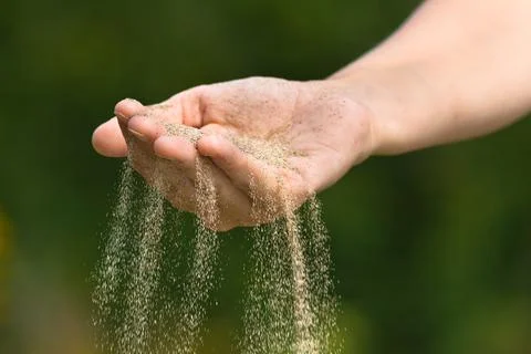 Time is running like the sand through your hand Stock Photos