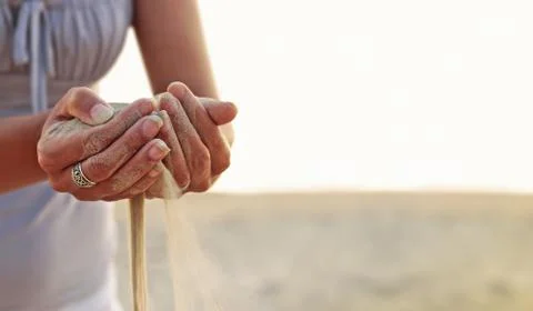 Time as the sand slips through your fingers.. Stock Photos