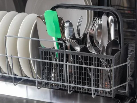 Time-saving technology. Open built-in dishwasher. Kitchen with integrated a.. Stockfoto's