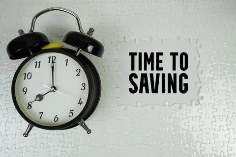 Time To Saving text with alarm clock on white background Foto stock