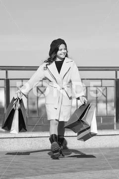 Time to shop. Shopping day. happy little girl. Autumn trend. Kid fashion look Stock Photos