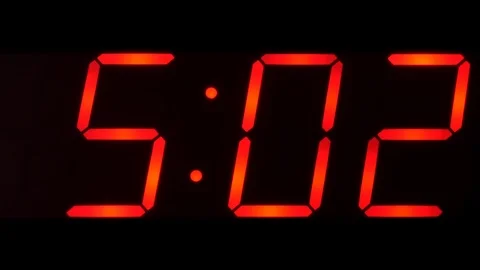 Time showing between 0500 and 0559 on big digital clock Stock Footage 92265428