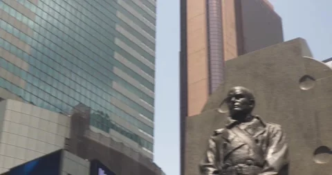 Time Square Statue of Father Francis P. Duffy in Front of Red Steps Stock Footage 246833287