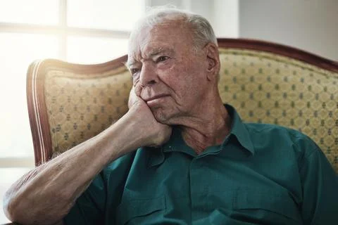 Time stands still when youre old. a senior man sitting by himself in a living Stock Photos