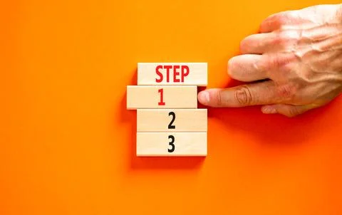 Time to step 1 symbol. Concept word Step 1 2 3 on wooden block. Businessman.. Stock Photos