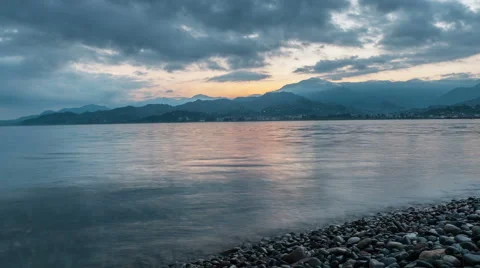 The time before the sun rises near the ocean. Beautiful mountains and clouds are Stock Footage 67764344