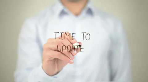 Time To Update , man writing on transparent screen Stock Footage 62763899