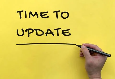 Time To Update text on yellow cover background. Stock Photos