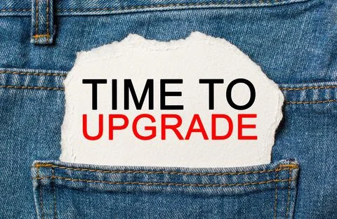 Time to upgrade on torn paper background on jeans business and finance concep Stock Photos