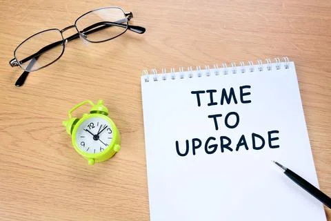 Time to upgrade words on notepad Stock Photos