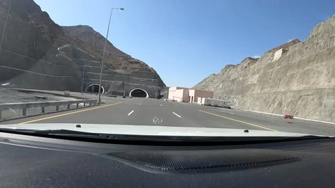 A time warp of car going through a new tunnel in Oman Stock Footage 138753121