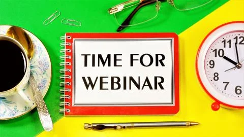 The time of the webinar  the inscription text of the work plans in a notebook Foto stock