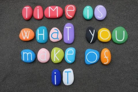 Time is what you make of it, wise words composed with multicolored stone letters Stock Photos