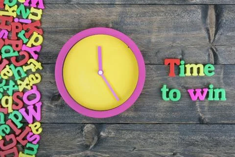 Time to win on wooden table 스톡 사진