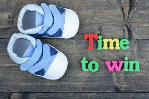 Time to win on wooden table Stock Photos