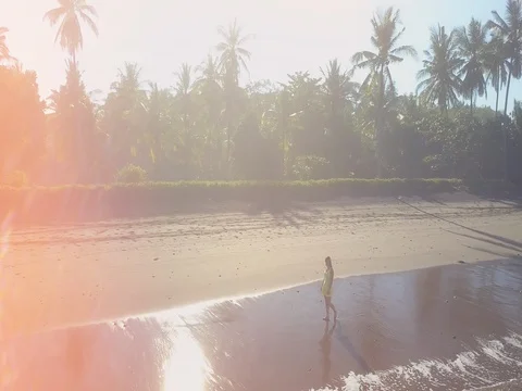 TIME WRAP: Woman in dress walking on dreamy sandy beach in sunny Bali island Stock Footage