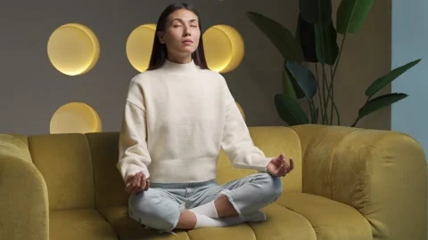 Time for yoga classes. Attractive young asian woman trains and sits in a yoga Video stock 168237845