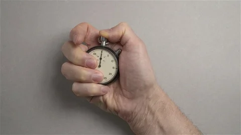 Timekeeper. A man's hand starts a stopwatch. top view Stock Footage 71484043