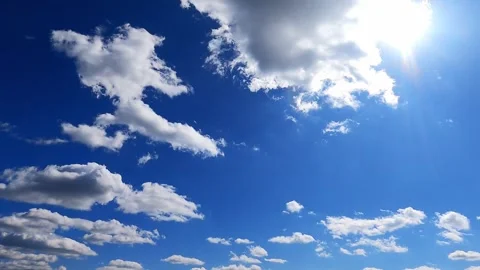 Timelabs white clouds fly quickly across sunny blue sky on summer day 2 Stock Footage 311366605