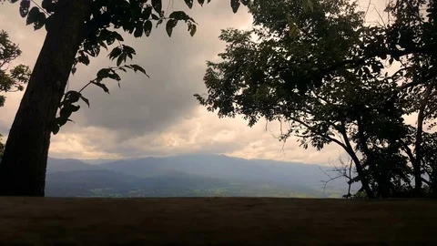 Timelape of the cloud over the tropical mountain With the wood table as foreg Stock Footage 82412090