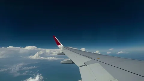 Timelaps : Airplan wing above the blue sky Stock Footage 91772629