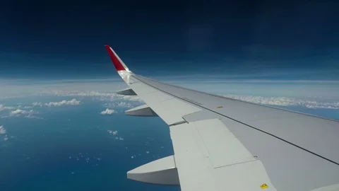 Timelaps : Airplan wing above the blue sky Stock Footage 91773583