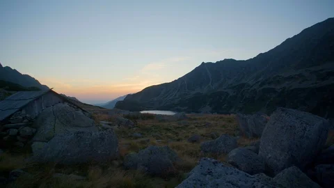 Timelaps camera slide of cottage in the mountains at sunset 4k HDR H264 Stock Footage 88268035