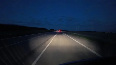 Timelaps of a car driving on a german highway during blue hour at night Stock Footage 283566809