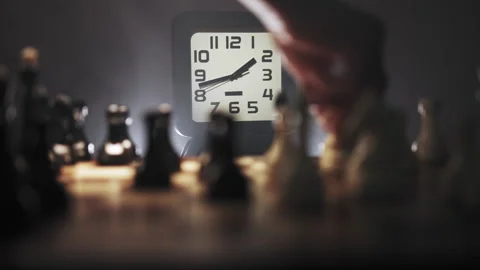 Timelaps chess game with chess pieces and white clock on background Stock Footage 312823351