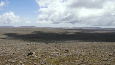Timelaps of a cloud covering an arid desert of rocks, in Ethiopia Stock Footage 230550352