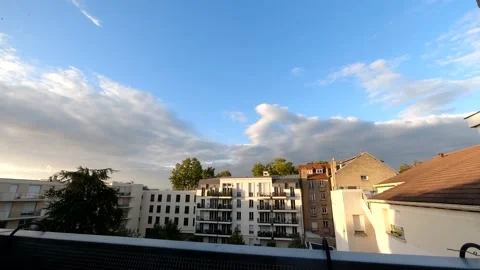 Timelaps of the clouds during good weather from a balcony in Paris Stock Footage 139980437