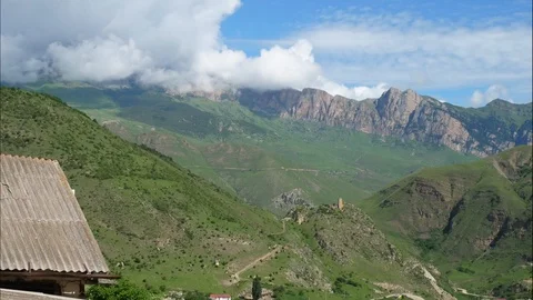 Timelaps of clouds over Ossetian mountains and old houses Stock Footage 93801881